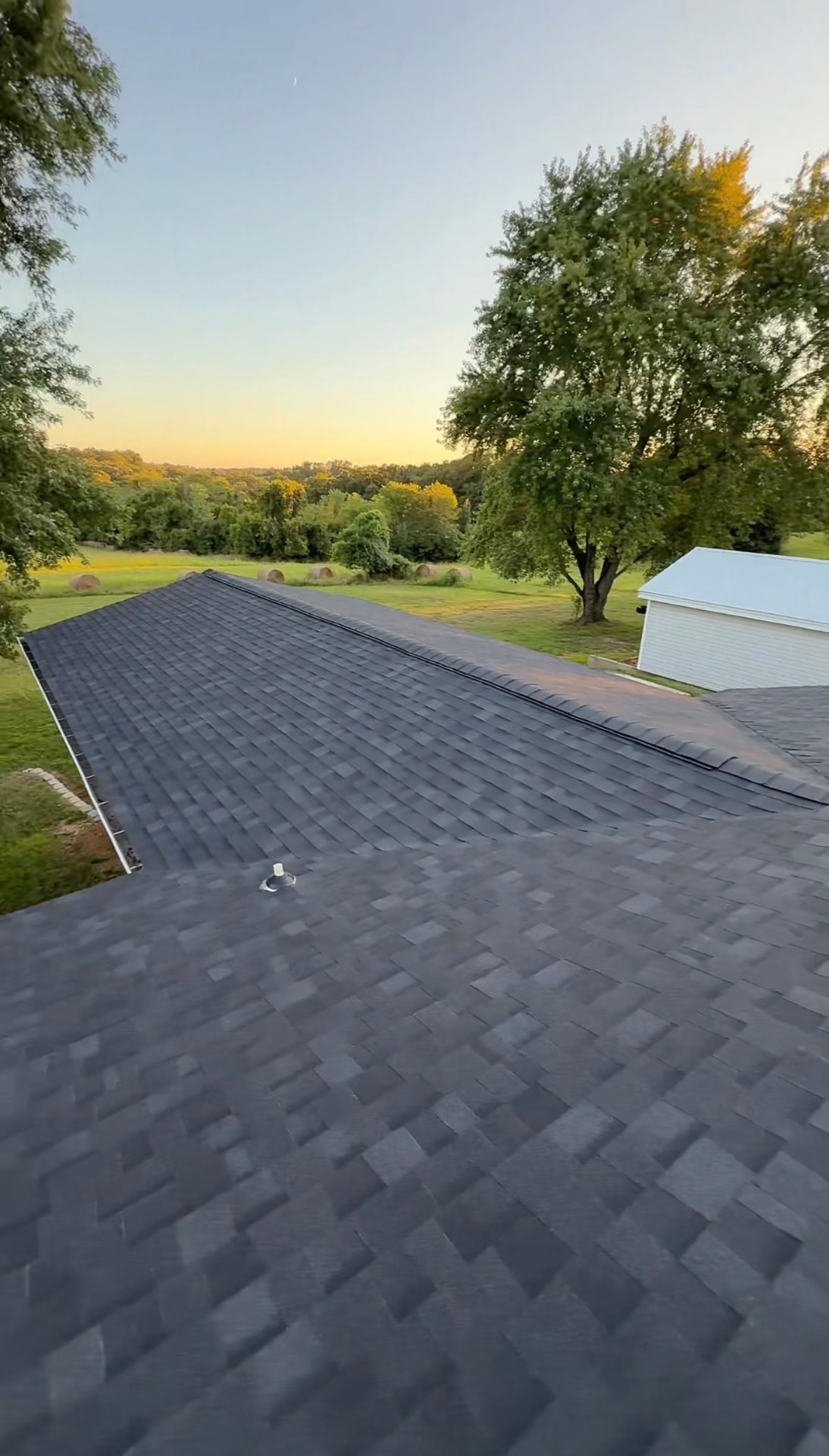 New roof installation on residential Missouri home at sunset